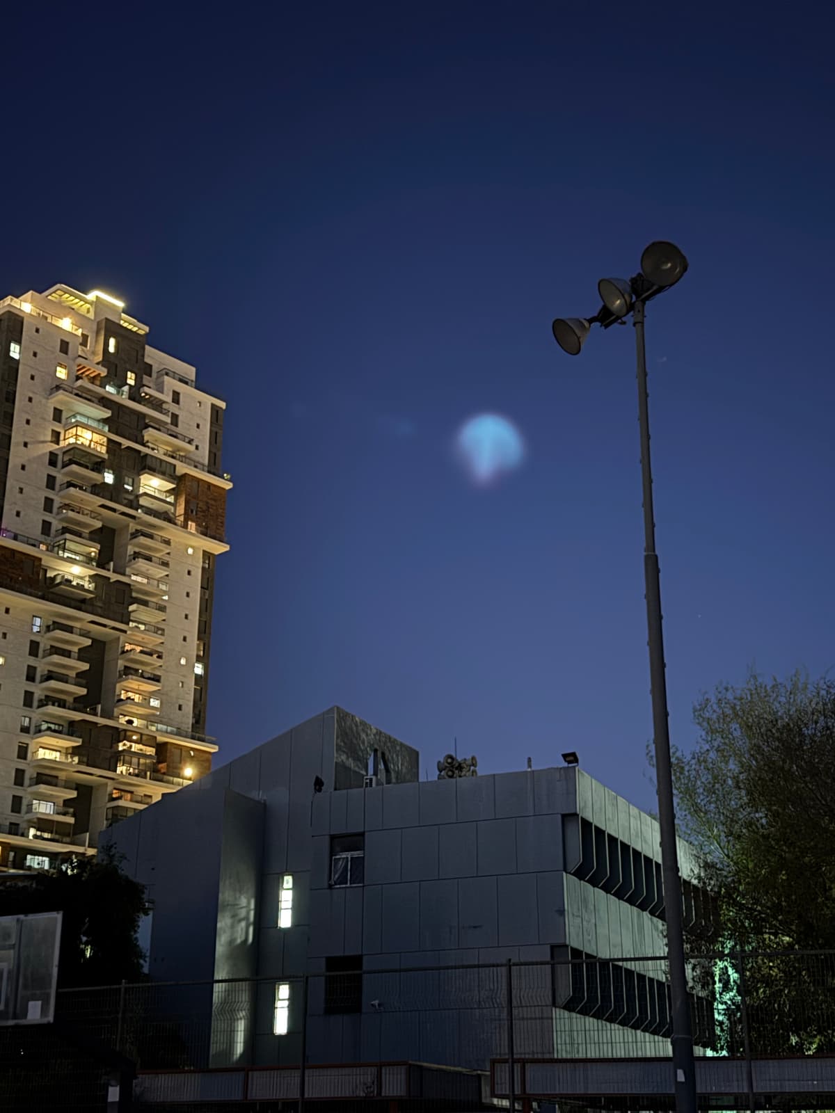 Night training (no lights) in a school on grass. Then I look up and see a space missile interception.