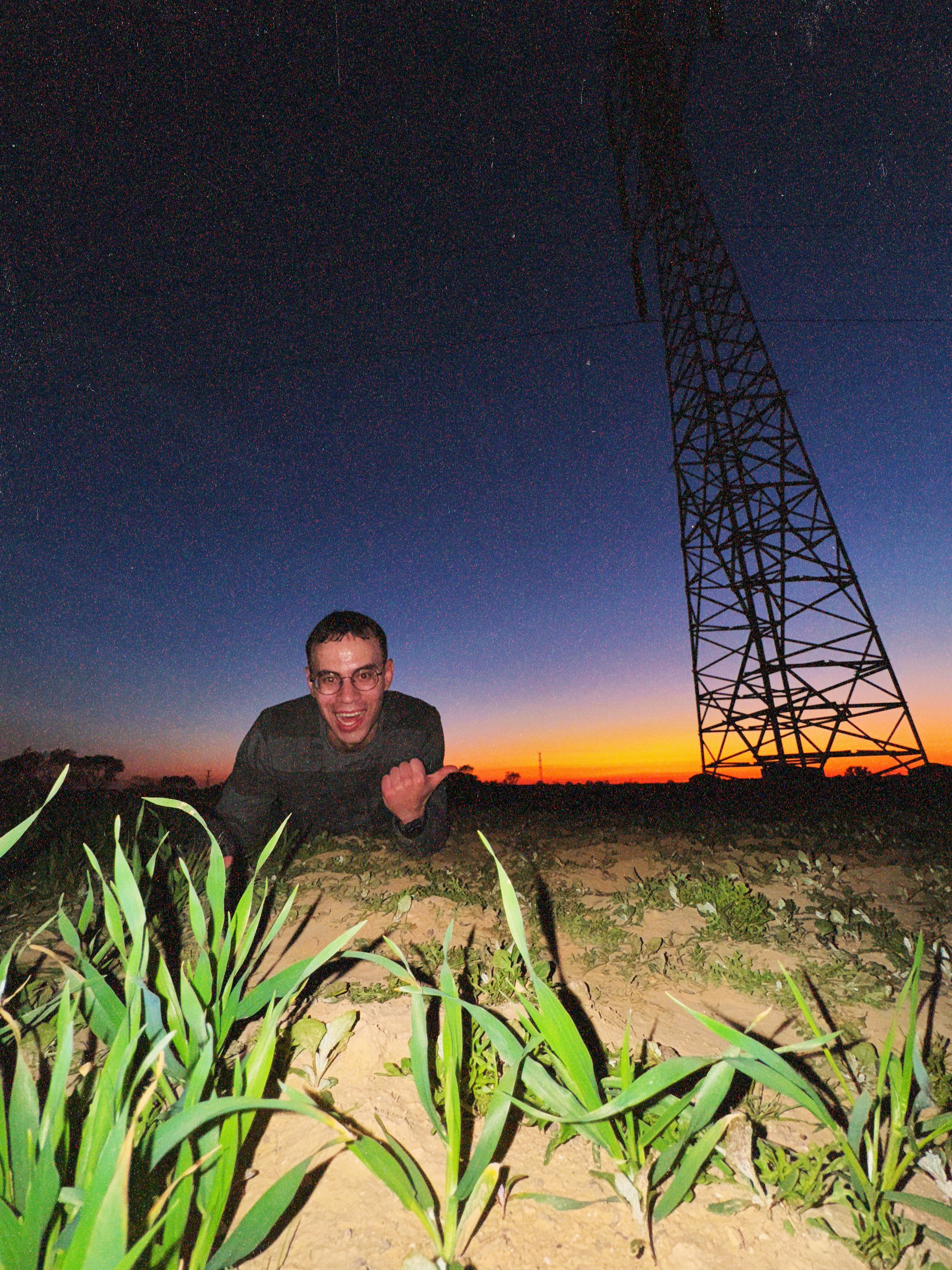You see, a normal person would think I am pointing to the sunset. Well, it is just a sunset isn't it? The grass though...